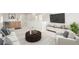 Bright living room with modern furnishings, including a wet bar and large television at 1048 Knox Ct, Denver, CO 80204