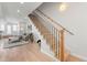 Inviting living area with hardwood floors, a gray sofa, and an open staircase leading to the second floor at 1048 Knox Ct, Denver, CO 80204