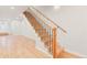 Bright stairway with light wood treads, black metal balusters, and a light wood handrail at 1048 Knox Ct, Denver, CO 80204