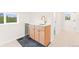 Functional wet bar with modern cabinets, countertops, and a beverage refrigerator at 1048 Knox Ct, Denver, CO 80204