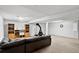 Spacious basement area with comfortable seating and a unique fireplace feature at 11835 W 37Th Pl, Wheat Ridge, CO 80033