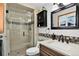 Modern bathroom featuring a glass-enclosed shower, stylish vanity, and contemporary finishes at 11835 W 37Th Pl, Wheat Ridge, CO 80033