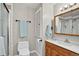 Clean bathroom with a shower, toilet, vanity, and coordinated towel set at 11835 W 37Th Pl, Wheat Ridge, CO 80033