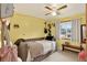 Cozy bedroom with fun decor, ambient lighting, and a view of the outdoors at 11835 W 37Th Pl, Wheat Ridge, CO 80033
