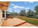 Wooden deck overlooking the yard, featuring railings and an outdoor umbrella at 11835 W 37Th Pl, Wheat Ridge, CO 80033