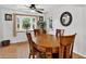 Inviting dining room with a bay window, wood floors, and traditional-style furniture at 11835 W 37Th Pl, Wheat Ridge, CO 80033