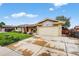 Exterior of a single-Gathering home with an attached two-car garage and a large concrete driveway at 11835 W 37Th Pl, Wheat Ridge, CO 80033