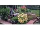 Beautiful flower garden with stone accents and landscape lighting at 11835 W 37Th Pl, Wheat Ridge, CO 80033