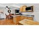 Open kitchen leading to a dining area, featuring wood floors and modern appliances at 11835 W 37Th Pl, Wheat Ridge, CO 80033
