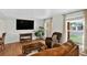Bright living room with hardwood floors, a large window, and comfortable seating with natural light at 11835 W 37Th Pl, Wheat Ridge, CO 80033
