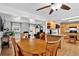 Open-concept living and dining area with hardwood floors, offering an inviting and connected space at 11835 W 37Th Pl, Wheat Ridge, CO 80033