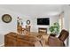 Open-concept living room with dining area featuring hardwood floors and plenty of natural light at 11835 W 37Th Pl, Wheat Ridge, CO 80033