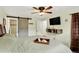 Relaxing bedroom with a barn door to the bathroom, TV, and neutral decor at 11835 W 37Th Pl, Wheat Ridge, CO 80033
