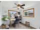 Well-lit home office space with dual windows, desk, and chair, perfect for productivity at 11835 W 37Th Pl, Wheat Ridge, CO 80033