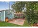 Backyard patio with seating area, shed, and garden decor at 11835 W 37Th Pl, Wheat Ridge, CO 80033