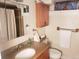 Bathroom featuring a granite countertop vanity and a shower/tub at 2860 Ames St, Wheat Ridge, CO 80214
