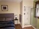 Bedroom showcasing a shower, accent wall, and natural lighting at 2860 Ames St, Wheat Ridge, CO 80214