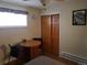 A cozy bedroom featuring a table and chairs, closet, and natural lighting at 2860 Ames St, Wheat Ridge, CO 80214