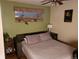 Cozy bedroom with a comfortable bed, natural light, and essential furnishings at 2860 Ames St, Wheat Ridge, CO 80214