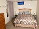 Comfortable bedroom features stylish geometric bedding and neutral decor at 2860 Ames St, Wheat Ridge, CO 80214