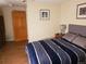 Bedroom featuring an outside door, and natural lighting at 2860 Ames St, Wheat Ridge, CO 80214