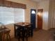 Breakfast nook with a small table with seating for four under a large window at 2860 Ames St, Wheat Ridge, CO 80214