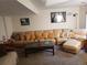 Spacious living room featuring a large sectional sofa and stylish decor at 2860 Ames St, Wheat Ridge, CO 80214