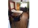 This living space includes a murphy bed, office space, and natural light at 2860 Ames St, Wheat Ridge, CO 80214