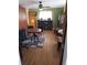 Office area with hardwood floors, a ceiling fan, built in shelving and a round table at 2860 Ames St, Wheat Ridge, CO 80214