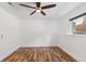 Bedroom featuring hardwood floors, a ceiling fan, and a window with blinds at 10890 W Evans Ave # 1G, Lakewood, CO 80227