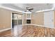 Living room with hardwood floors, fireplace and sliding glass doors to the outside space at 10890 W Evans Ave # 1G, Lakewood, CO 80227