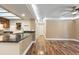 Bright living room featuring wood floors, neutral walls, and a ceiling fan at 10890 W Evans Ave # 1G, Lakewood, CO 80227