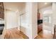 Hallway with hardwood floors and built-in shelving at 8379 Hackamore Rd, Littleton, CO 80125