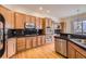 Well-equipped kitchen with granite countertops and ample cabinetry at 8379 Hackamore Rd, Littleton, CO 80125