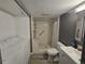 This bathroom features a walk-in shower, toilet, and laundry at 8600 E Alameda Ave # 105, Denver, CO 80247