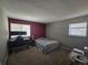 Comfortable bedroom with plush carpet, ample natural light, and a dedicated workspace at 8600 E Alameda Ave # 105, Denver, CO 80247