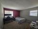 This bedroom features natural light and a computer setup at 8600 E Alameda Ave # 105, Denver, CO 80247