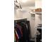 Walk-in closet with ample shelving, hanging rods, and convenient storage solutions at 8600 E Alameda Ave # 105, Denver, CO 80247