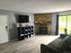 Comfortable living room features fireplace, television, and outdoor access at 8600 E Alameda Ave # 105, Denver, CO 80247