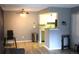 A open living space, adjoining kitchen, and wood floors at 8600 E Alameda Ave # 105, Denver, CO 80247