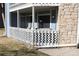 Comfortable covered porch with white railing, perfect for relaxing outdoors at 8600 E Alameda Ave # 105, Denver, CO 80247