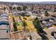 Community aerial view showcasing a putting green, pool, garden, green space, mature trees, and low-rise architecture at 7176 S Vine E Cir, Centennial, CO 80122