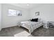 Bedroom with a large window, natural light, and minimalistic furnishings at 7176 S Vine E Cir, Centennial, CO 80122