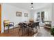 Inviting dining room with wood floors, natural light, and modern furnishings for stylish meals at 7176 S Vine E Cir, Centennial, CO 80122