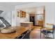 View of the kitchen featuring wood cabinets, stainless steel appliances, and an eat-in island at 7176 S Vine E Cir, Centennial, CO 80122
