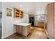 Kitchen with wood cabinets, stainless steel appliances, and bright overhead lighting at 7176 S Vine E Cir, Centennial, CO 80122