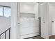 Washer and dryer closet on the second floor, featuring an open louvered door at 7176 S Vine E Cir, Centennial, CO 80122