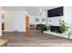 Spacious living room with hardwood floors and a white fireplace opens to the dining area at 7176 S Vine E Cir, Centennial, CO 80122