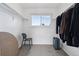 Walk-in closet with carpet flooring, a window, and open storage racks for organizing clothes at 7176 S Vine E Cir, Centennial, CO 80122