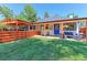 The backyard offers an ideal blend of open green space and inviting outdoor living areas at 2337 S Franklin St, Denver, CO 80210